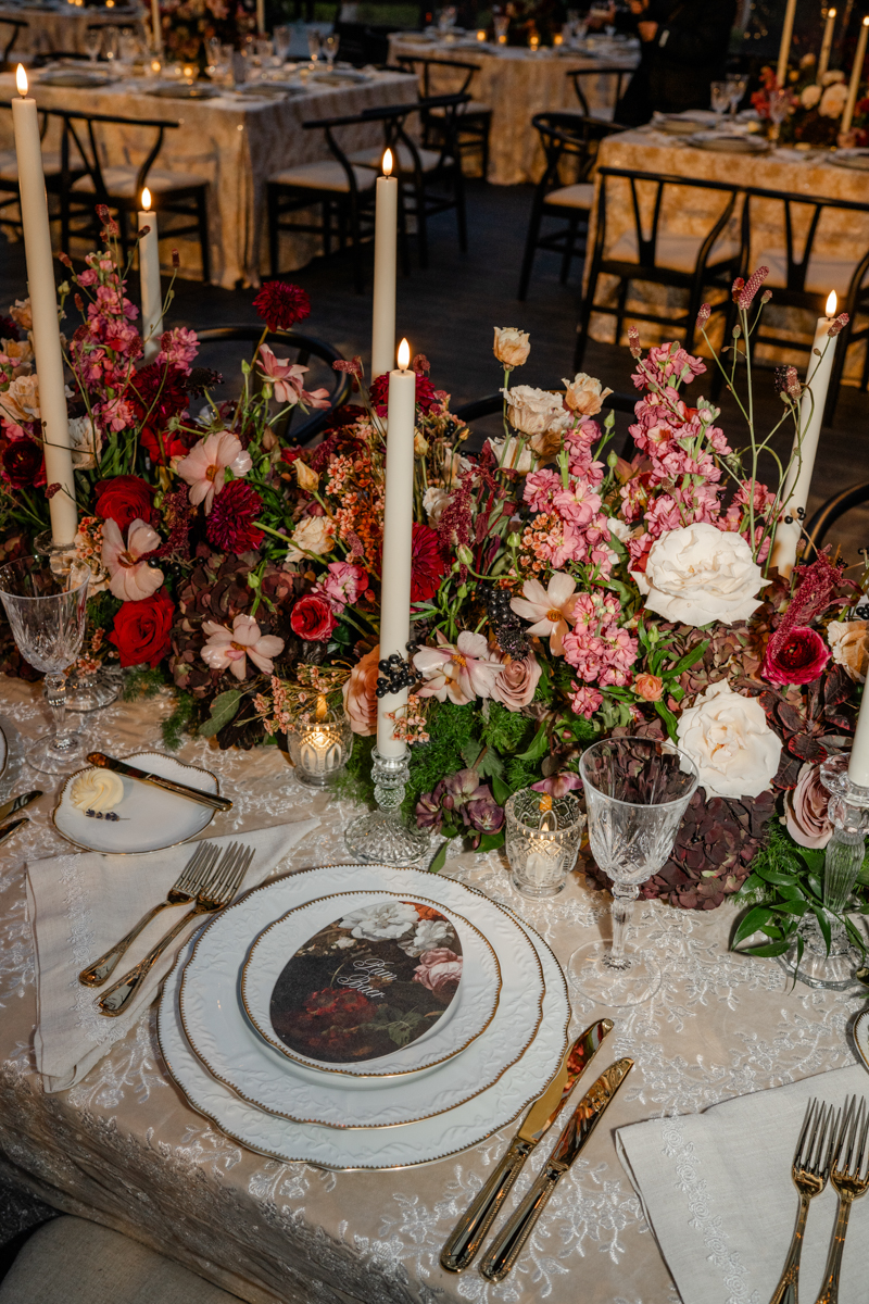 Tented maroon wedding with crystal chandelier