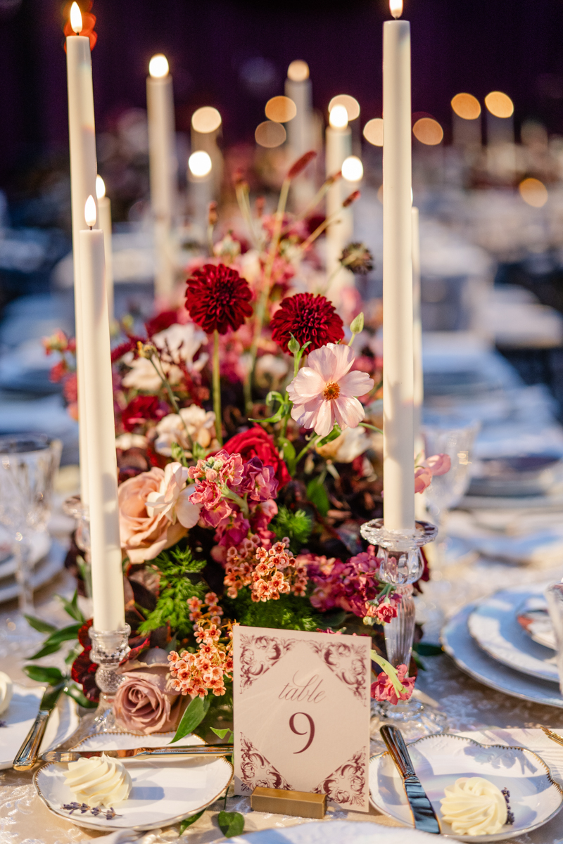 Tented maroon wedding with crystal chandelier