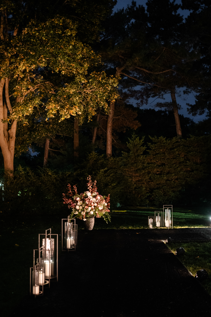 Tented maroon wedding with crystal chandelier