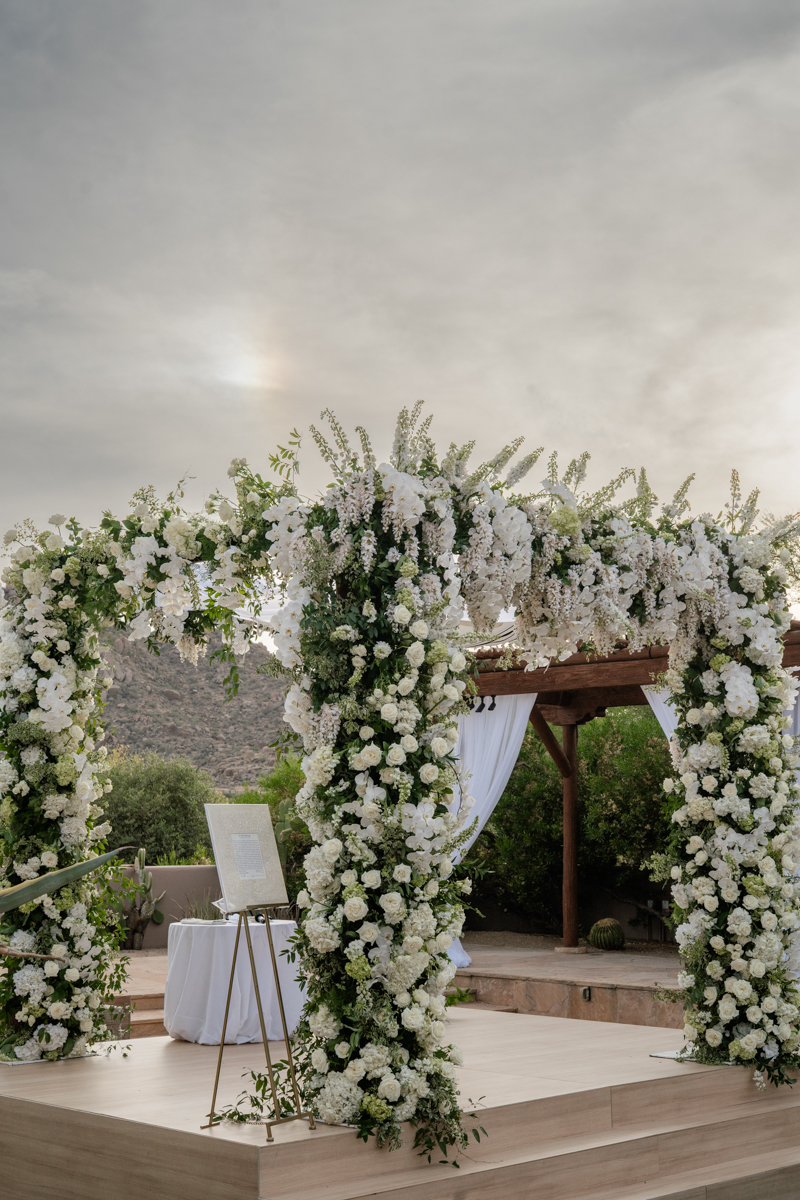 white and green floral chuppah