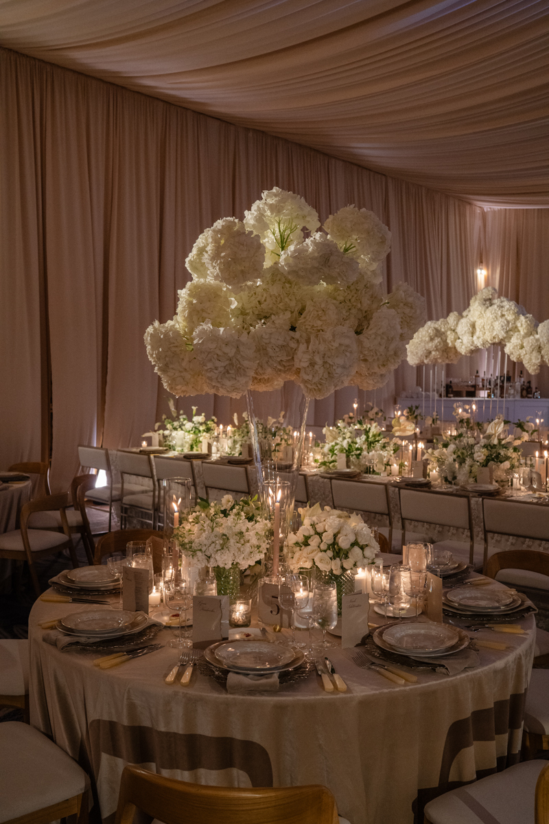 draped ballroom with candles and hydrangea centerpieces
