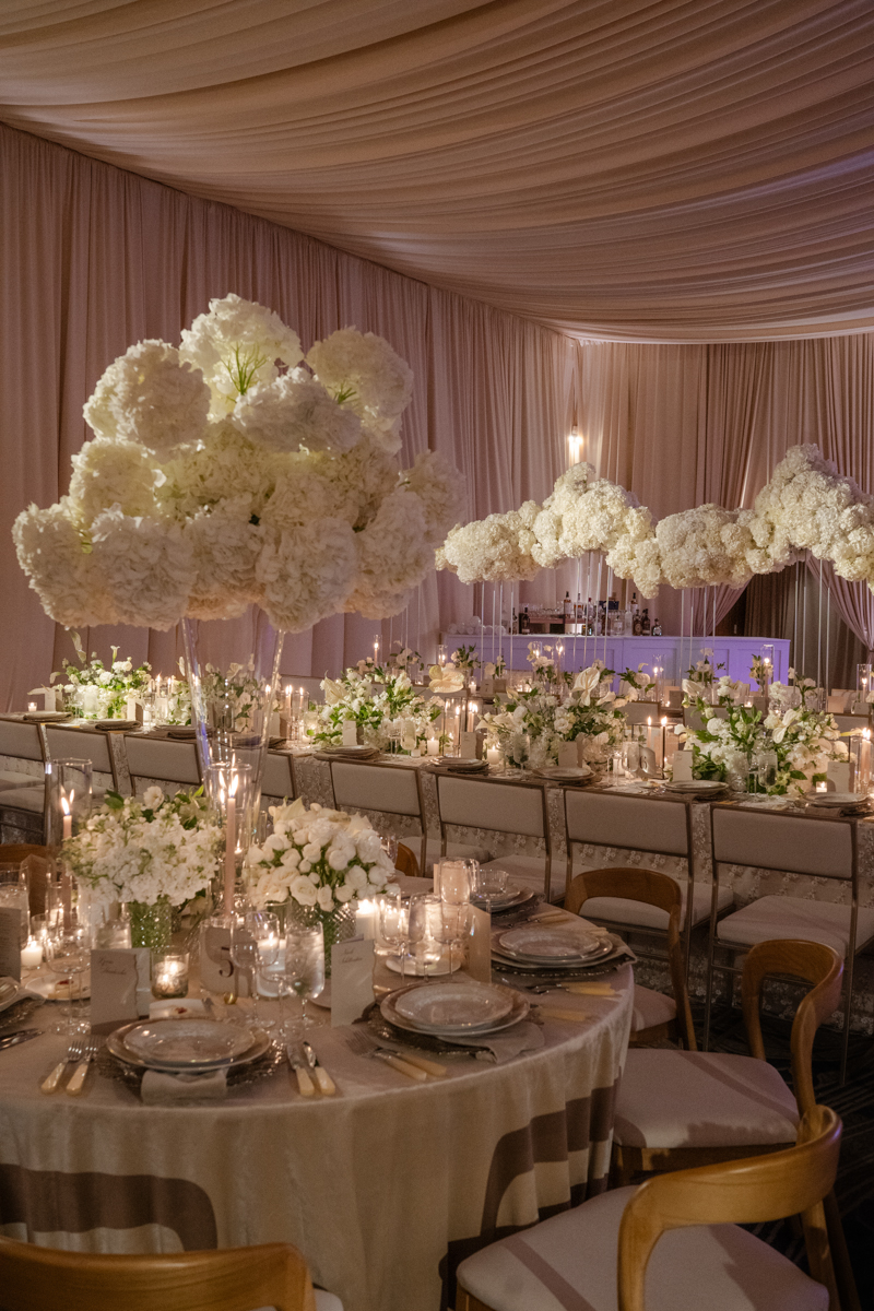 draped ballroom with candles and hydrangea centerpieces