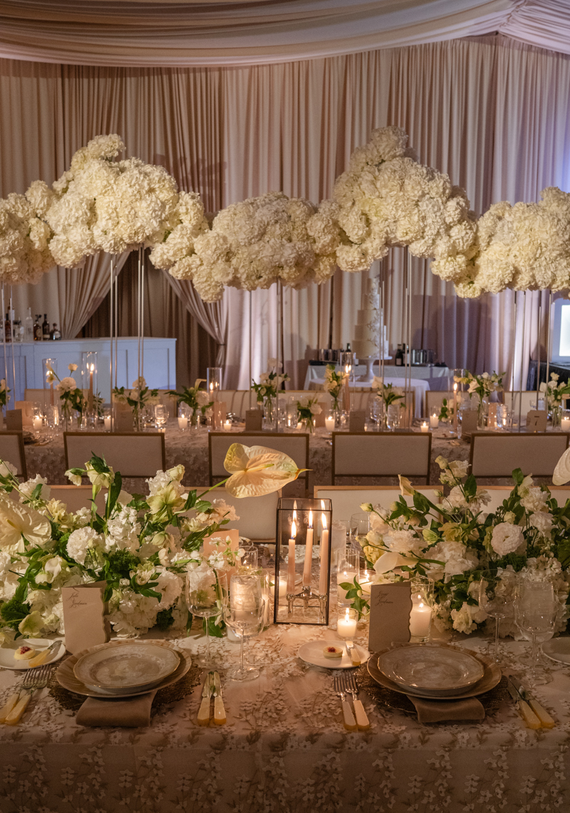 draped ballroom with candles and hydrangea centerpieces