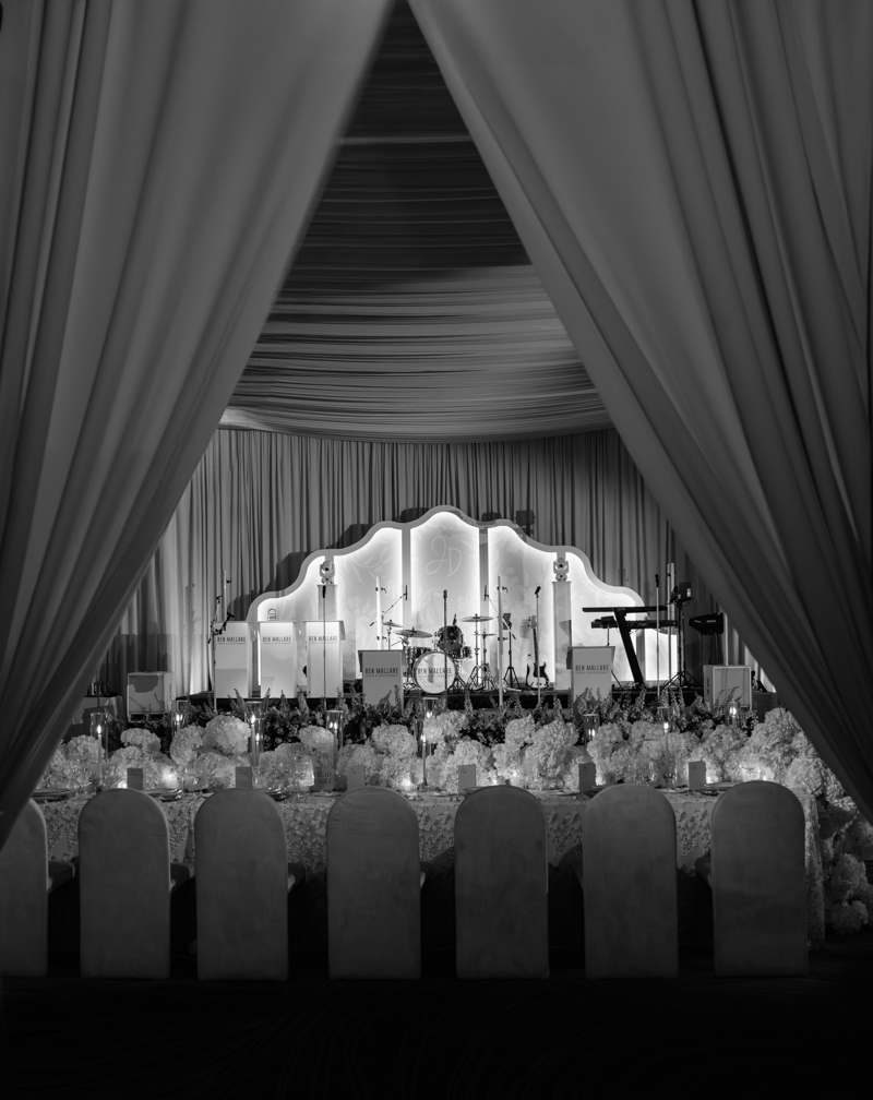 draped ballroom with candles and hydrangea centerpieces