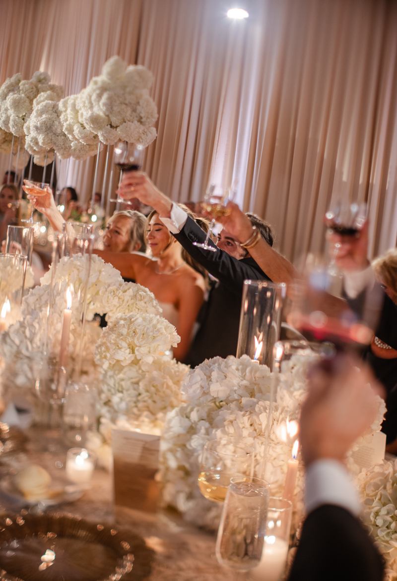 bride and groom watching speeches