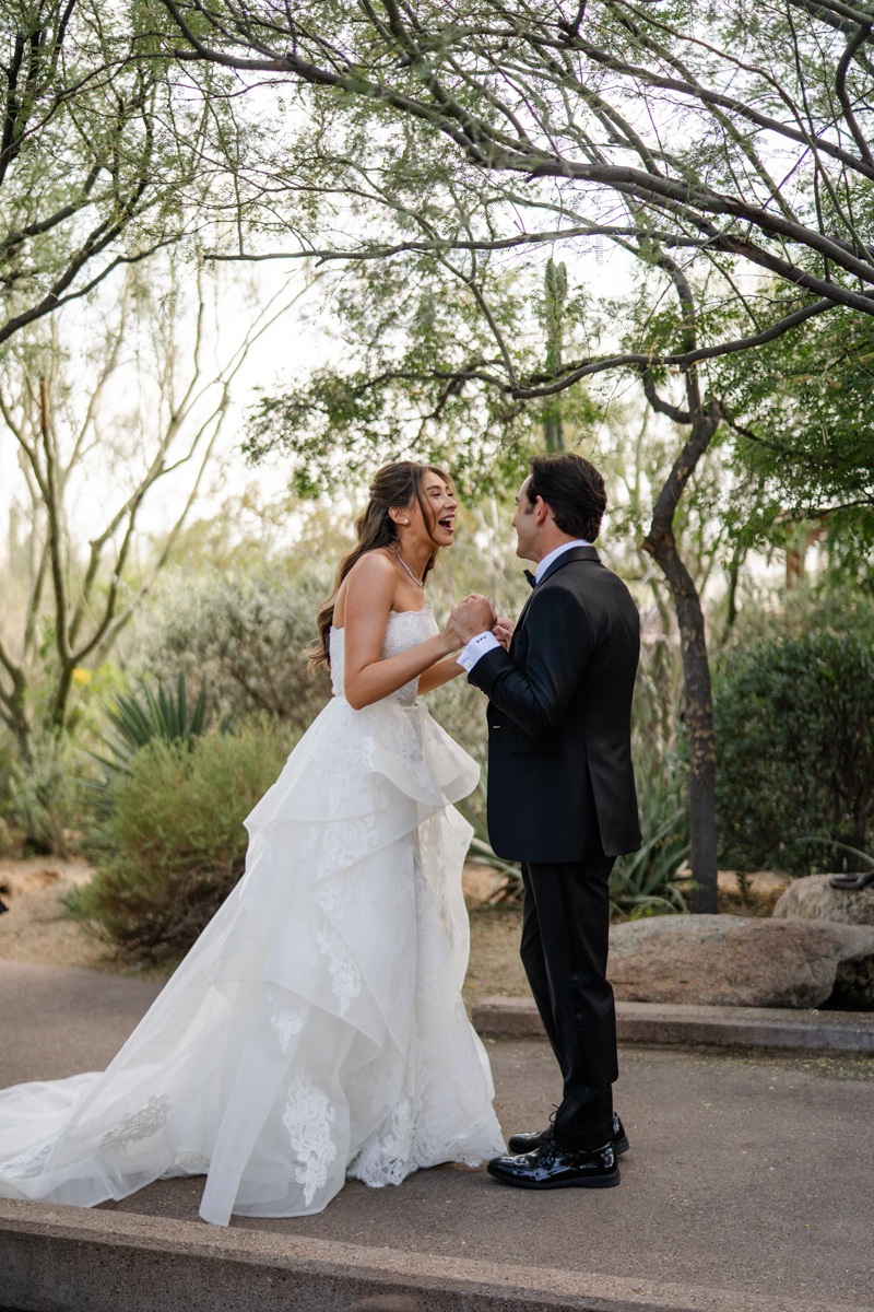 bride and groom first look in the desert