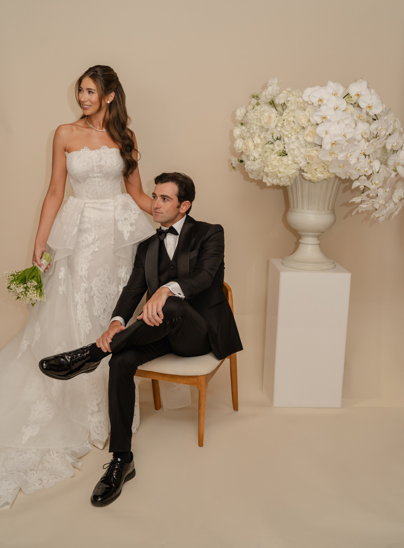 bride and groom editorial photos with floral piece