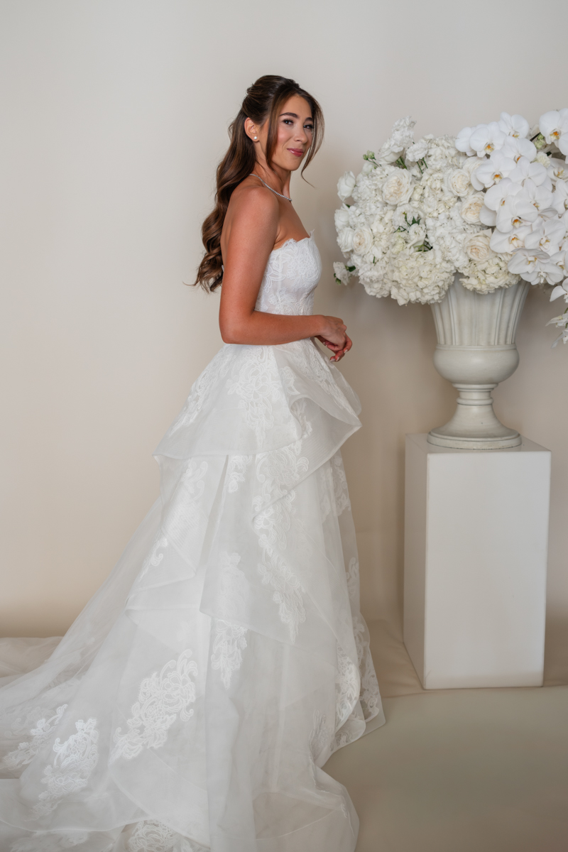 bride and groom editorial photos with floral piece