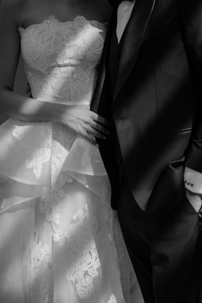 bride and groom editorial photos with floral piece