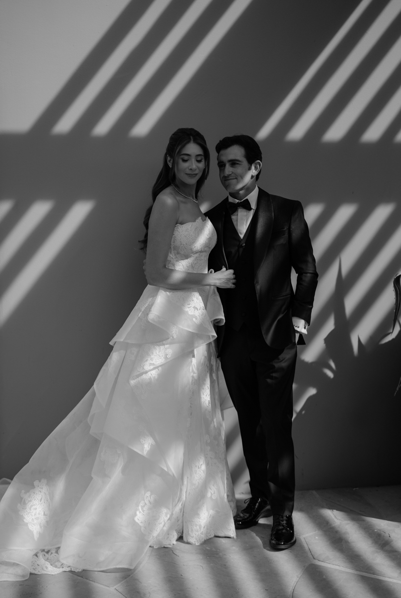 bride and groom editorial photos with floral piece