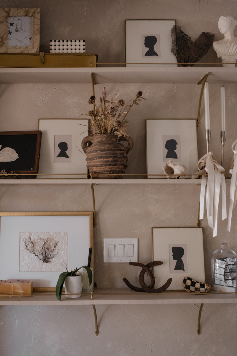 paintings on shelves